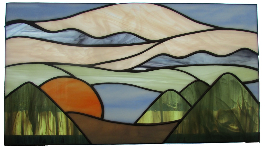 stained glass sunset in mountains