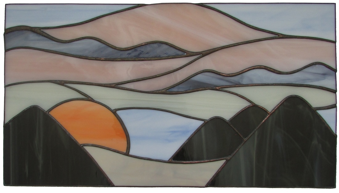 stained glass sunset in mountains